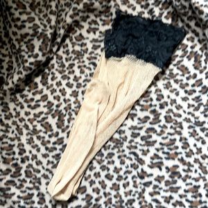 Nude fishnet stockings. Thigh high. Lace